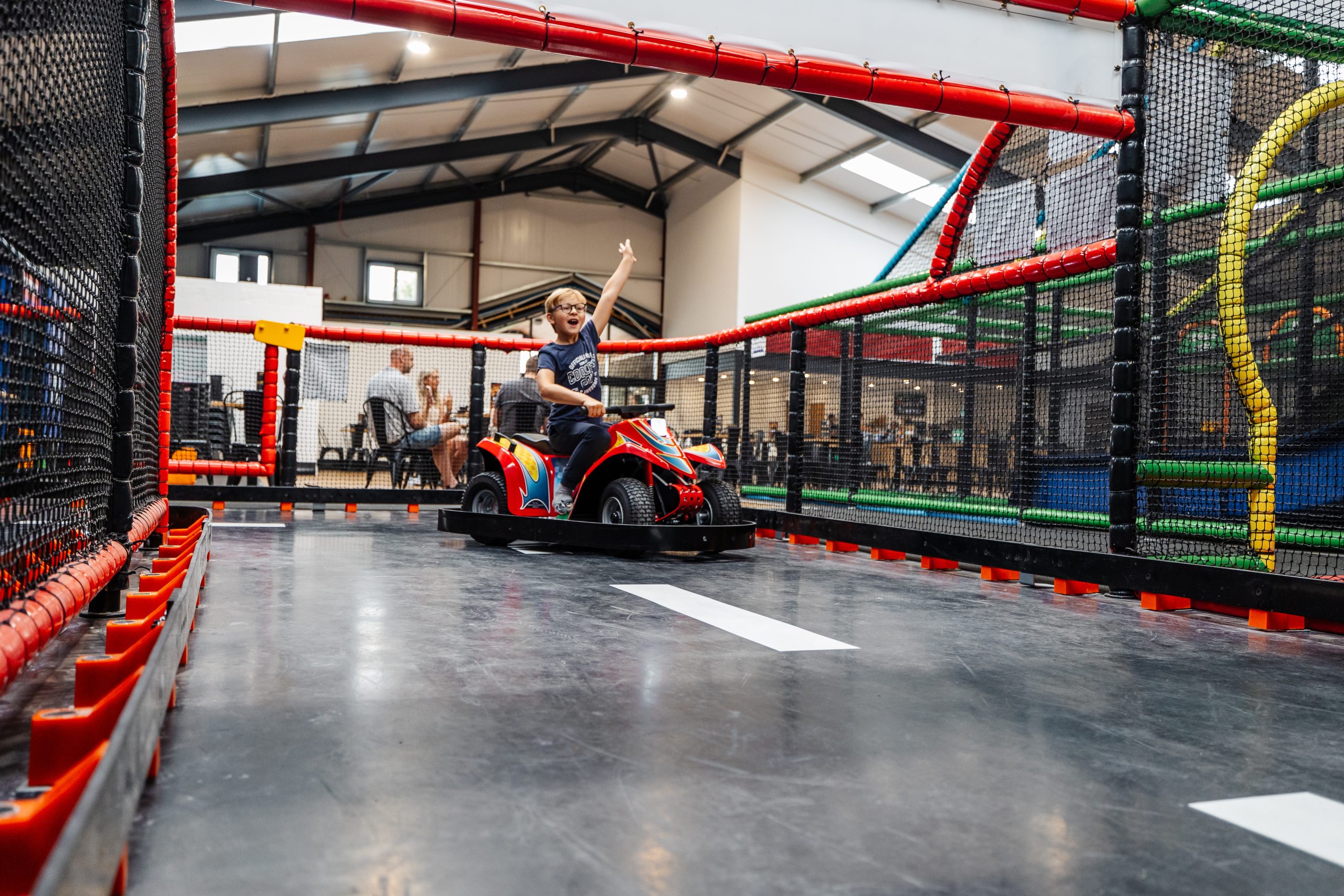Child riding indoor go karts at Thornton Hall Country Park near Skipton