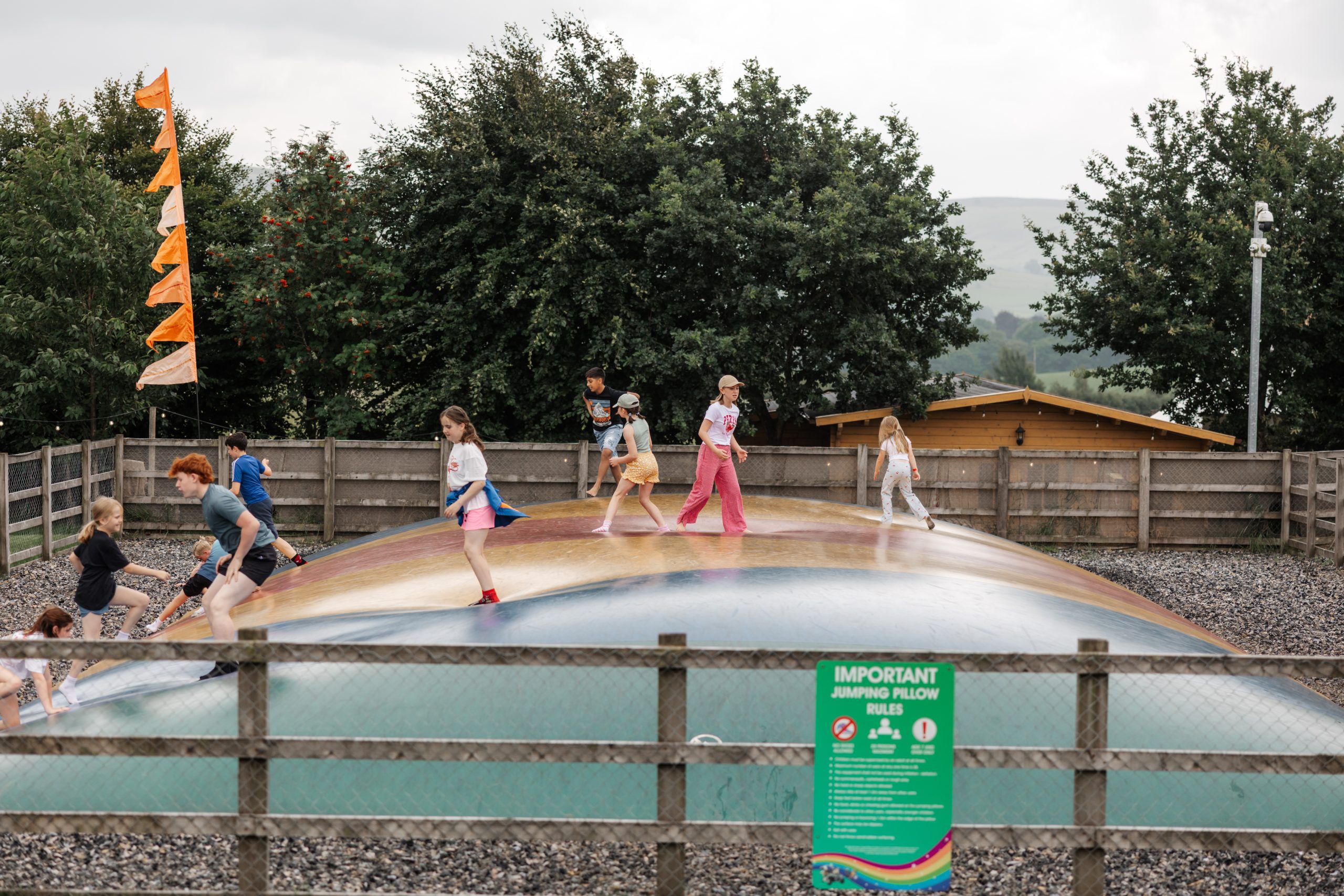 Children playing on jumping pillow at Thornton Hall Country Park near Skipton