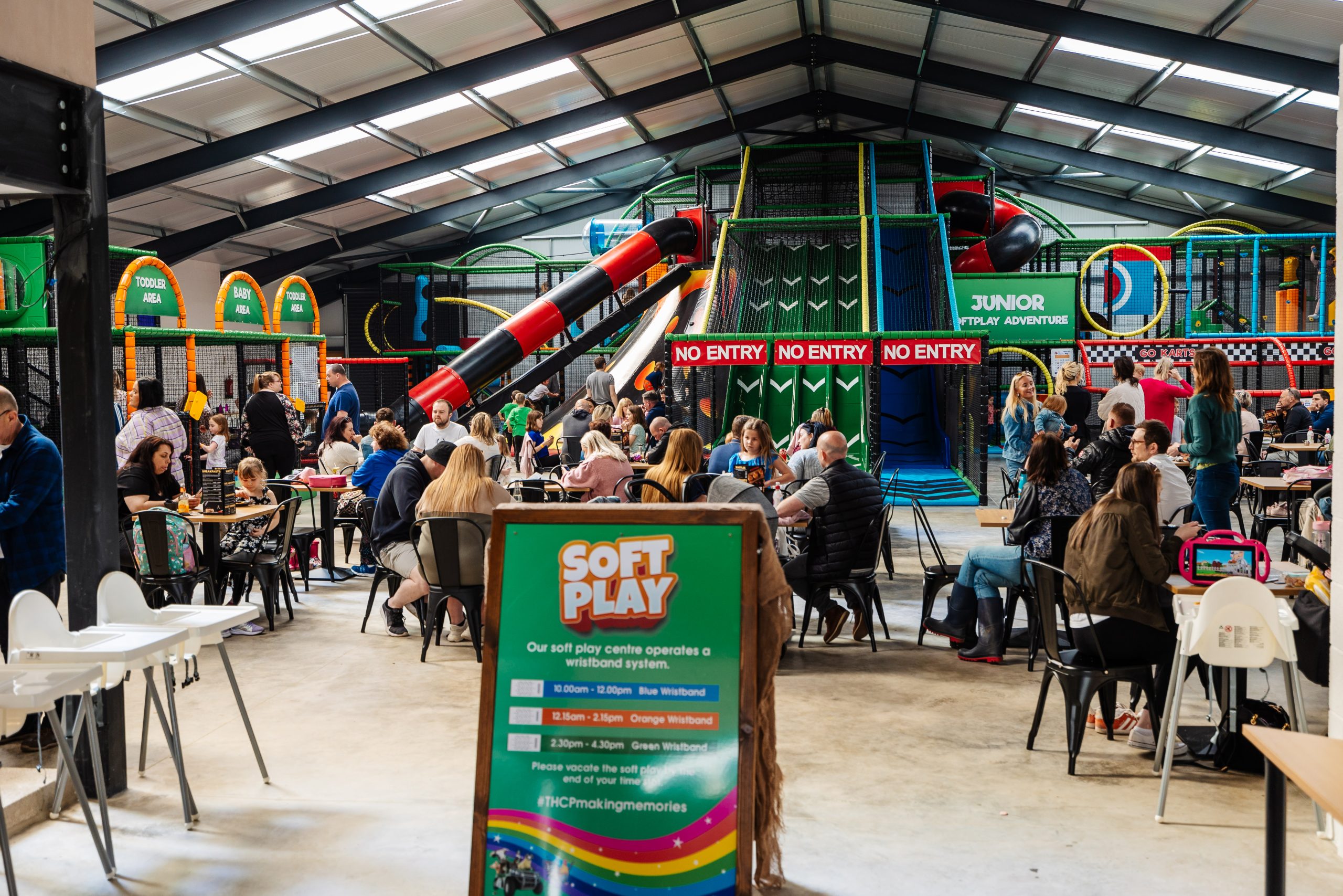 Indoor soft play area at Thornton Hall Country Park with families and children playing near Skipton